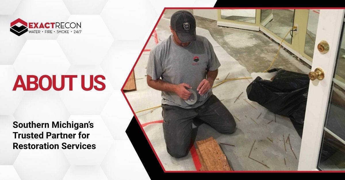 Promotional graphic for Exact Recon, a restoration services company in Southern Michigan. The left section features the company logo, the text 'WATER • FIRE • SMOKE • 24/7', and the headline 'ABOUT US' with the tagline 'Southern Michigan’s Trusted Partner for Restoration Services' on a light grey hexagonal background. The right section shows a photo of a man kneeling on a concrete floor, working with tape, surrounded by debris and a doorframe in the background.